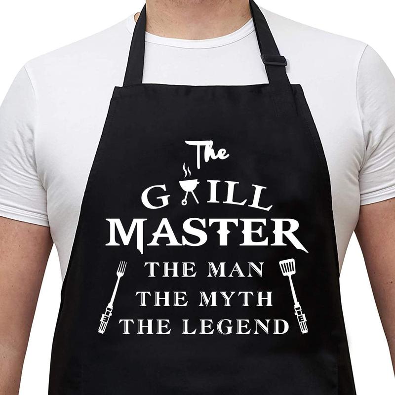 Funny Aprons for Men - The Grill Master, The Man The Myth The Legend - Cooking Grilling BBQ Chef Apron for a Husband, Dad Gifts,  Oil Proof Black Apron with 2 Pockets